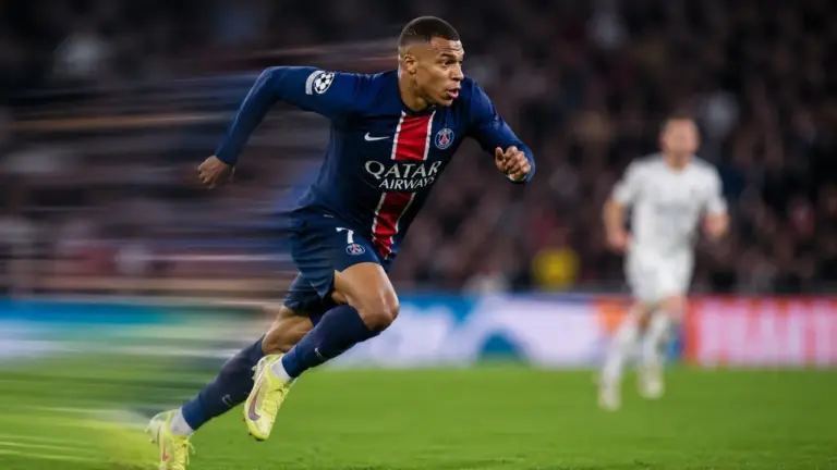 Fastest football player sprinting at full speed during a professional football match.